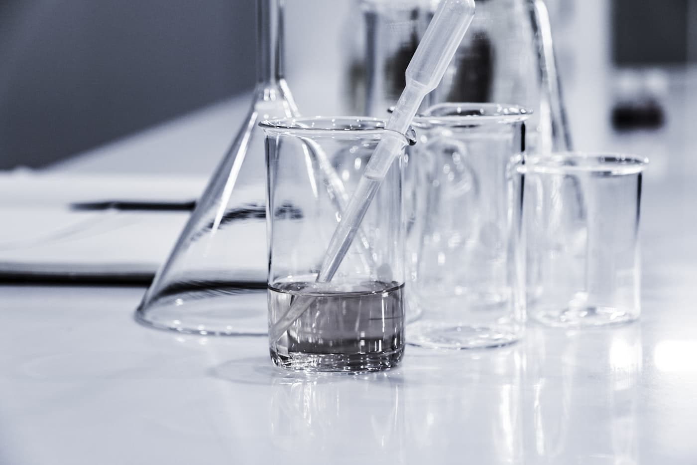 Clean laboratory glassware on a white bench
